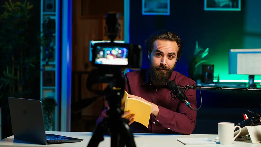 Content creator in a studio doing novel summaries for interested readers
